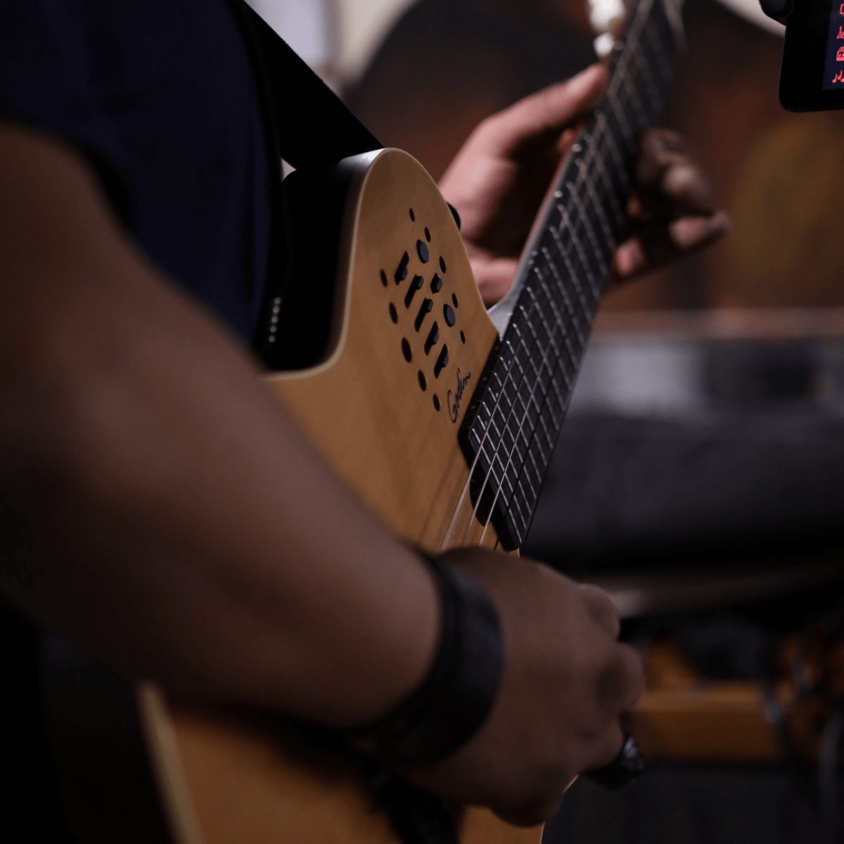 a man holding a guitar