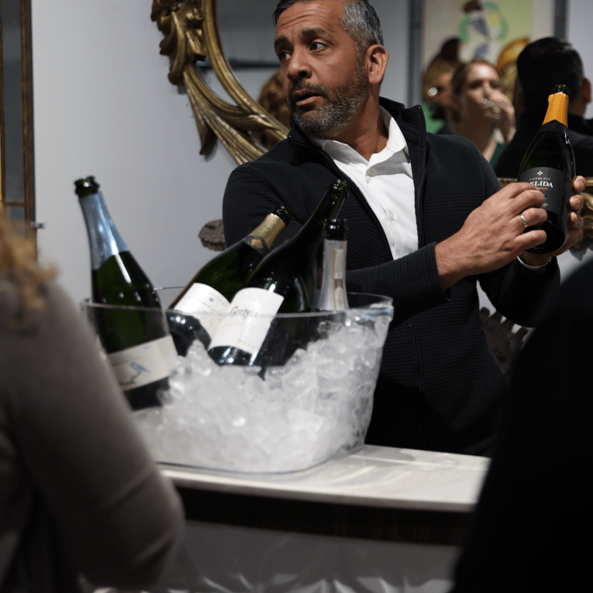 a person holding a glass of wine