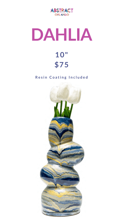Abstract wavy vase with blue and yellow patterns and white flowers.
