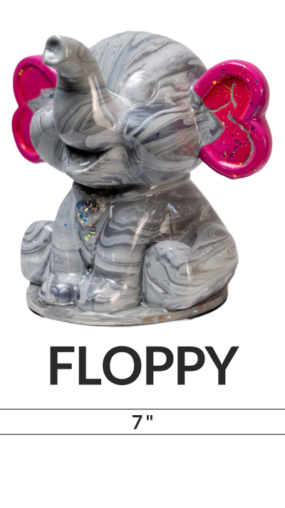 Marbled elephant figurine with pink glitter ears labeled 'Floppy' and '7 inch' beneath.