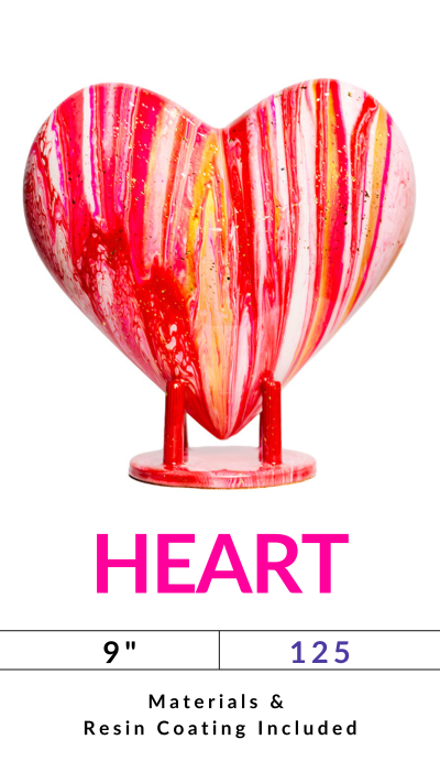 A colorful heart sculpture with pink, gold, and white stripes on a stand.